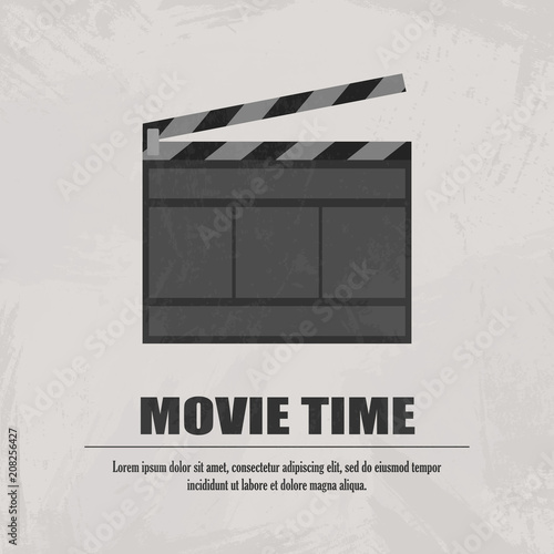 Grey movie clapboard at light background