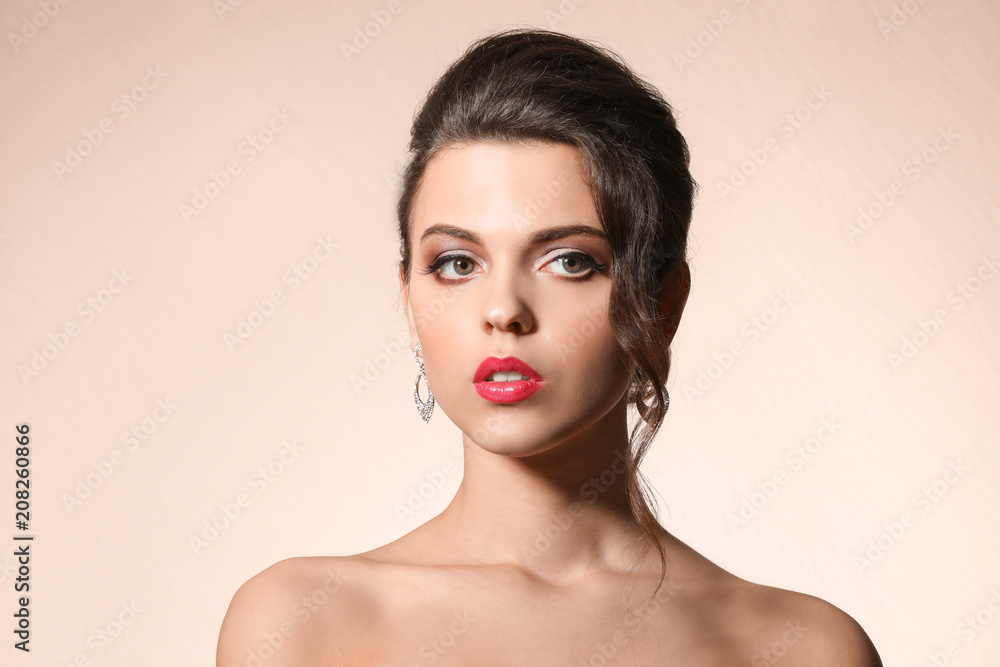 Portrait of young woman with beautiful professional makeup on color background Portrait of young woman with beautiful professional makeup on color background