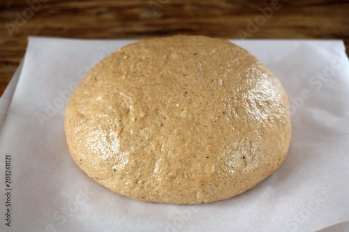 Rye dough is prepared for baking on a piece of parchment