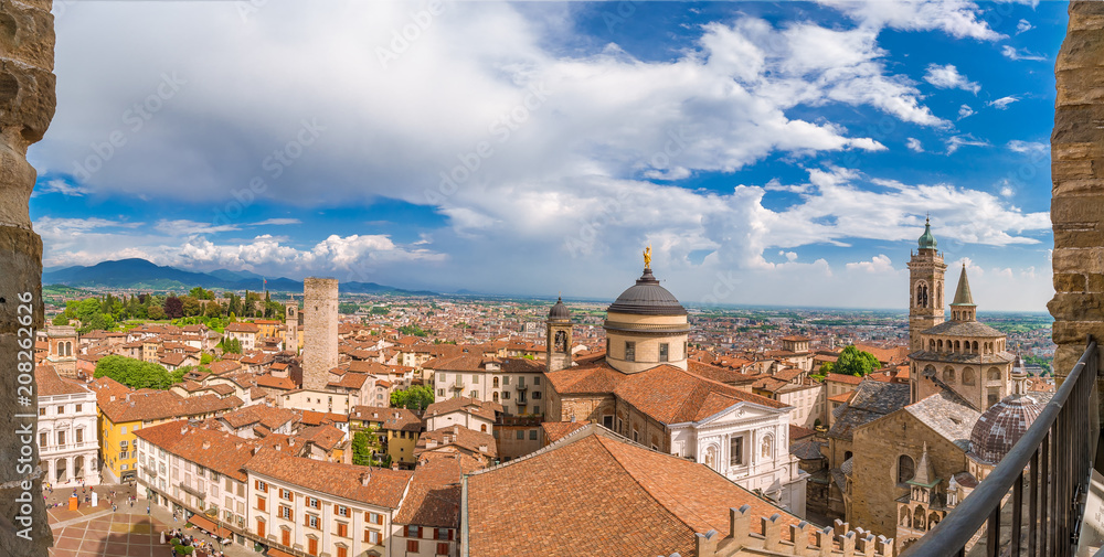 Aerial view of the Basilica of Santa Maria Maggiore and Cappella Colleoni in Citta Alta of Bergamo, Italy on a sunny day
