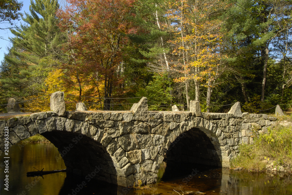 New Hampshire stone bridge colorful foliage background