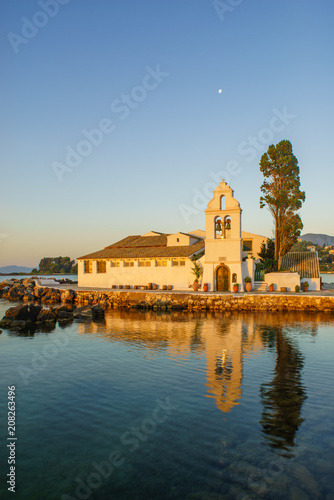 Vlacherna Monastery on the Kanoni peninsula in Corfu at sunrise photo