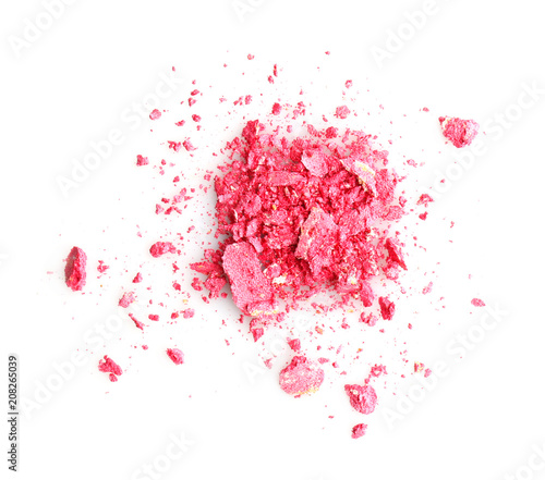 Crushed makeup product on white background. Professional cosmetics