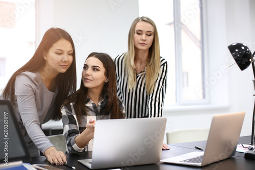 Young people having business meeting in office