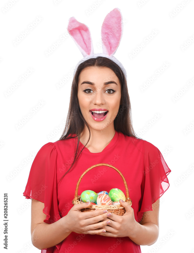 Beautiful young woman with Easter eggs and bunny ears on white background Beautiful young woman with Easter eggs and bunny ears on white background