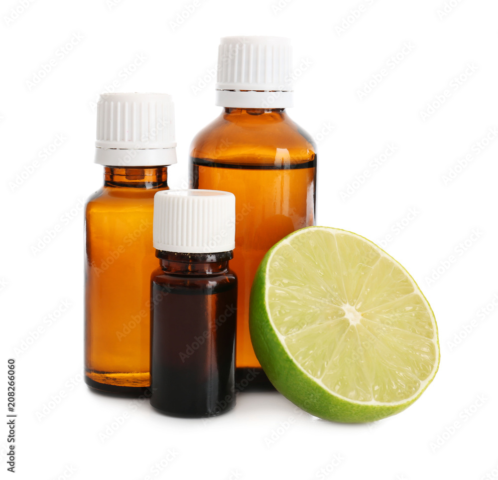 Bottles with lime essential oil on white background Bottles with lime essential oil on white background