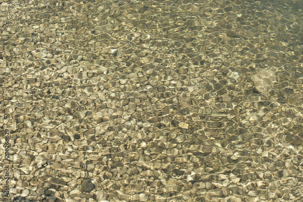 Glare and ripples on clear and clear water in a clean lake. Glare and ripples on clear and clear water in a clean lake.