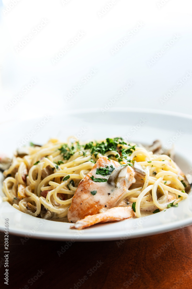 tasty pasta with salmon on a the table