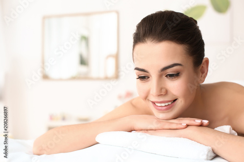 Young woman relaxing in spa salon