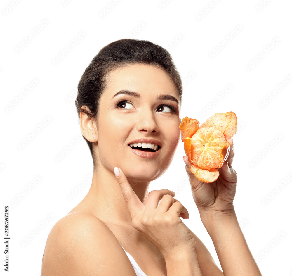 Beautiful young woman with citrus fruit on white background Beautiful young woman with citrus fruit on white background