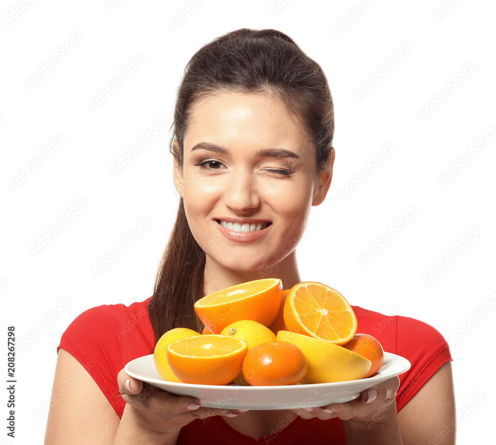 Beautiful young woman with plate full of citrus fruits on white background Beautiful young woman with plate full of citrus fruits on white background