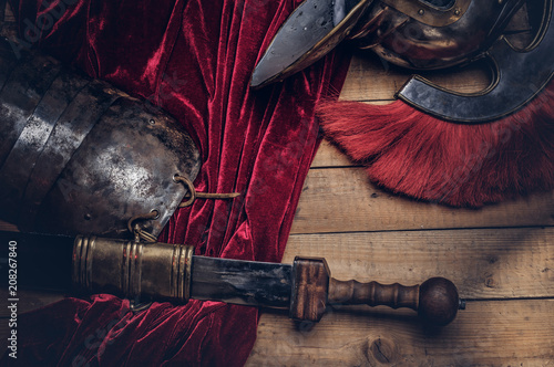 Quadro su tela Complete combat equipment of the ancient Greek warrior on a wooden boards