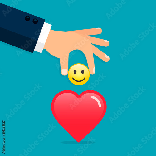 Hand put emoticon smile in heart, giving a good mood concept illustration. Vector concept
