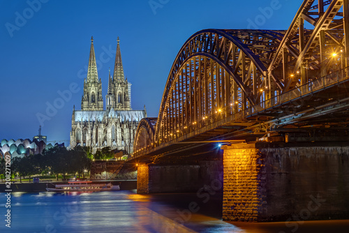 The Cologne Cathedral and the Hohenzollern railway bridge after sunset