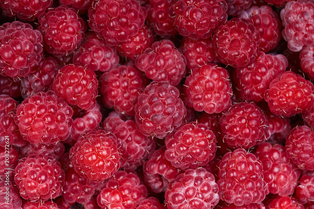 Background of a beautiful fresh raspberry. Healthy food. Vegetarianism. Background of a beautiful fresh raspberry. Healthy food. Vegetarianism.