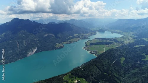 Wallpaper Mural Aerial panoramic view of lake Wolfgangsee in summer, beautiful scenery with majestic lush green slopes and peaks of Alps mountains - picturesque landscape of Austria from above, Europe  Torontodigital.ca