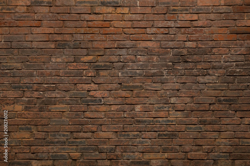 Dark brown old bricks wall