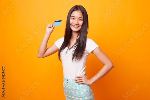 Young Asian woman smile with blank card.