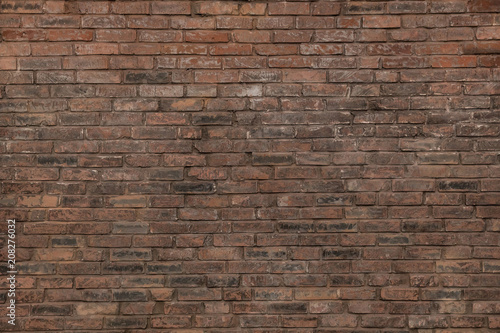 Dark brown old bricks wall