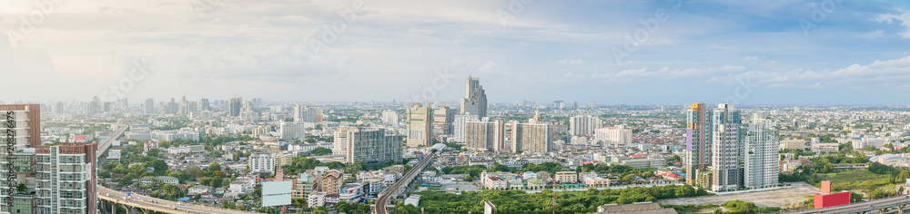 Obraz premium Aerial view of city, Landscape of Bangkok city skyline in Aerial view with skyscraper, modern office building and blue sky with cloudy sky background in Bangna Bangkok, Thailand.