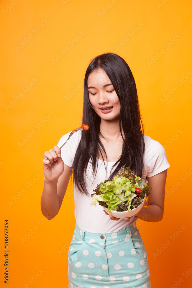 Healthy Asian woman with salad.