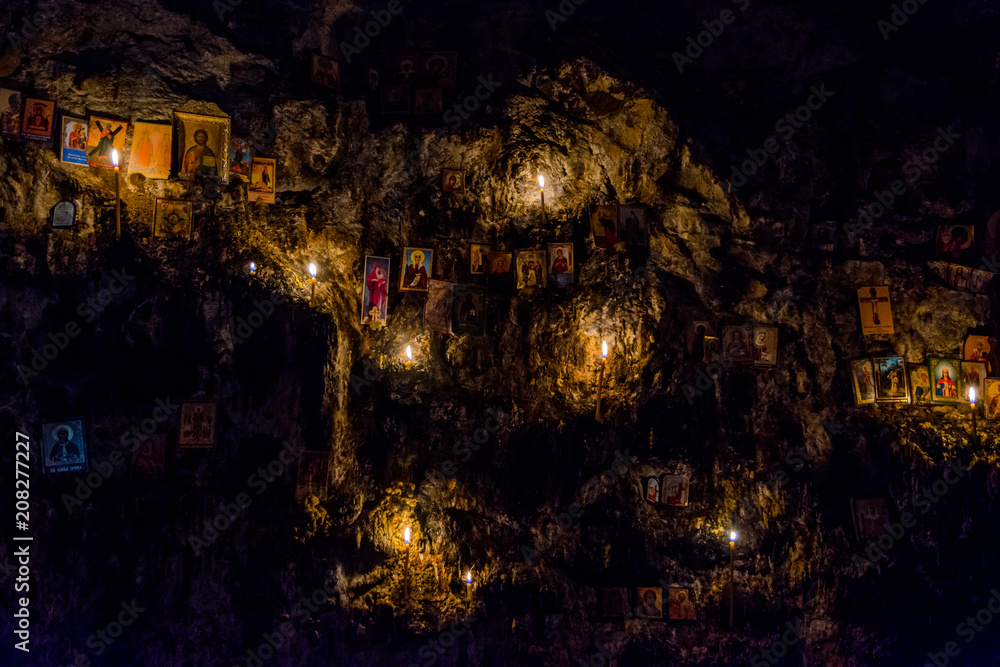 Candles and relics in the cave - obrazy, fototapety, plakaty 
