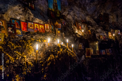 Candles and relics in the cave © dinozzaver