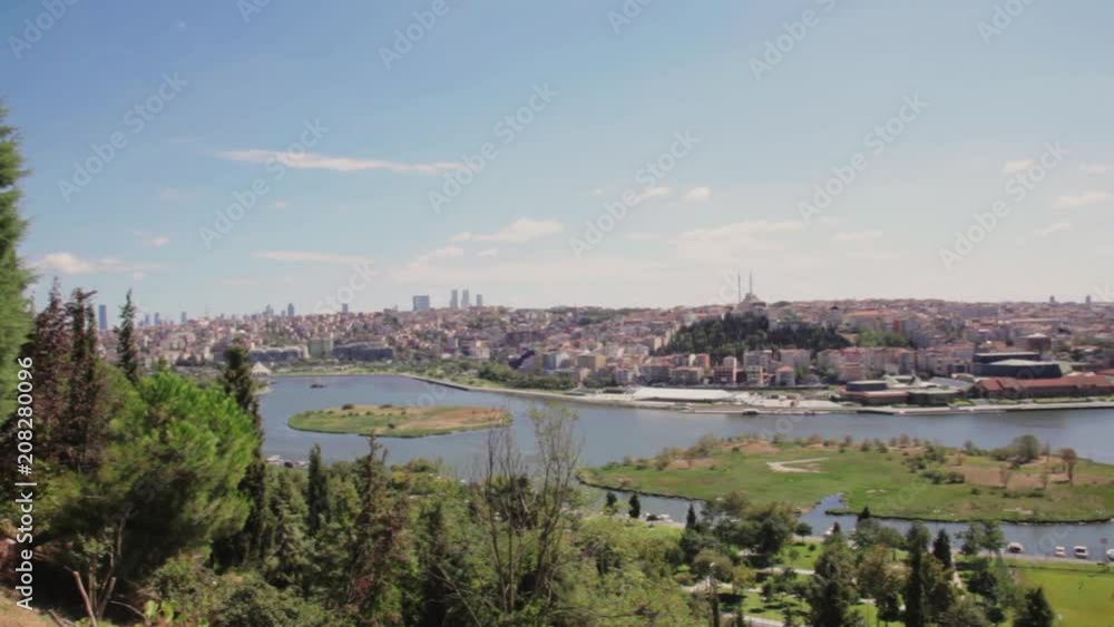 Cemetery Sultan Eyup, The Halich Bridge and panoramic view of the Golden Horn Bay in Istanbul, Turkey. Cemetery Sultan Eyup, The Halich Bridge and panoramic view of the Golden Horn Bay in Istanbul, Turkey.