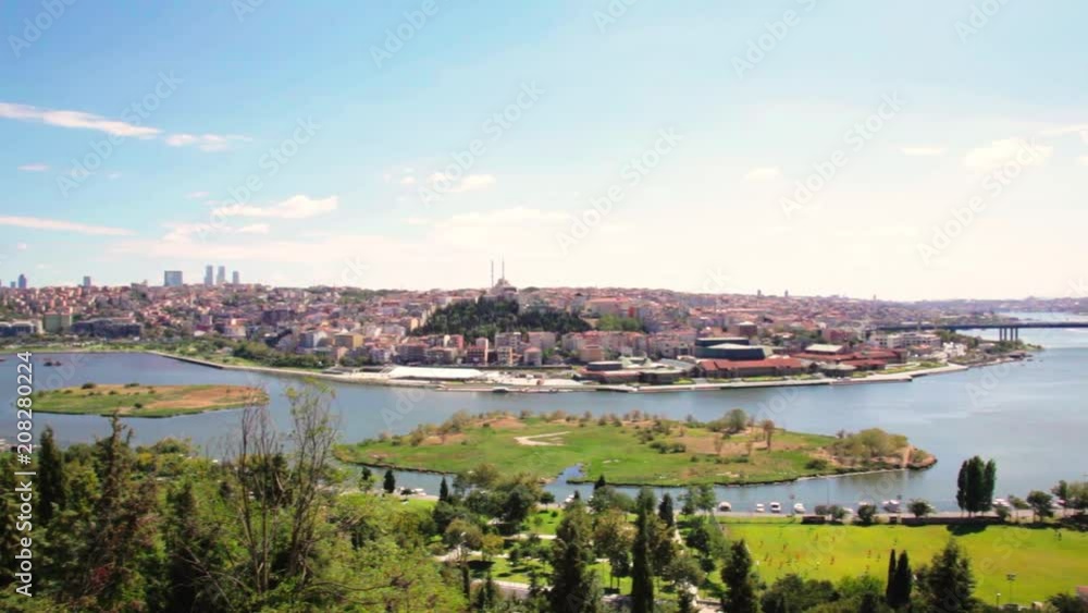 Cemetery Sultan Eyup, The Halich Bridge and panoramic view of the Golden Horn Bay in Istanbul, Turkey. Cemetery Sultan Eyup, The Halich Bridge and panoramic view of the Golden Horn Bay in Istanbul, Turkey.