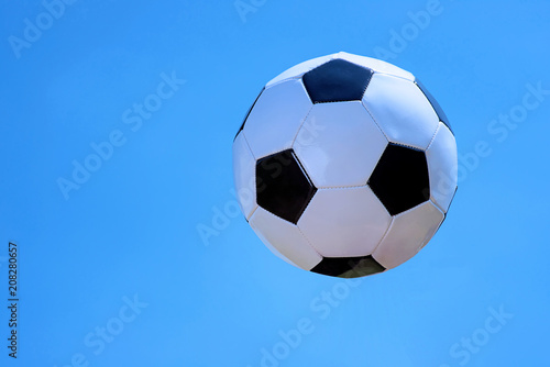 Soccer ball on sky background