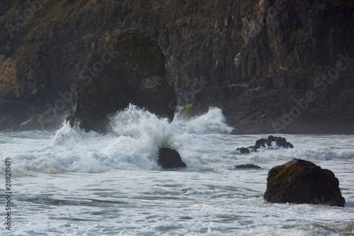 Evening waves batter a sea stack off Cape Meares, Tillamook County, Oregon.