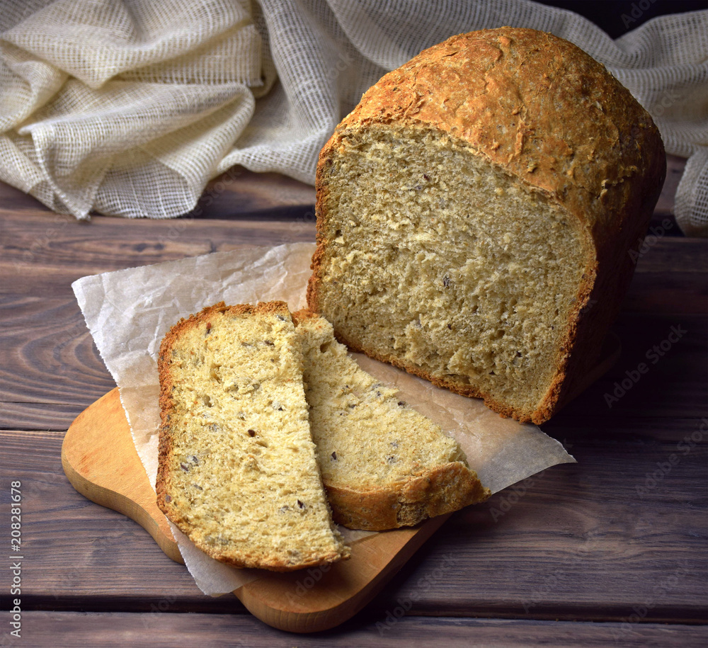 Homemade bread from whole wheat flour. Homemade bread with sunflower seeds and bran. Healthy eating. Baking on hop leaven.