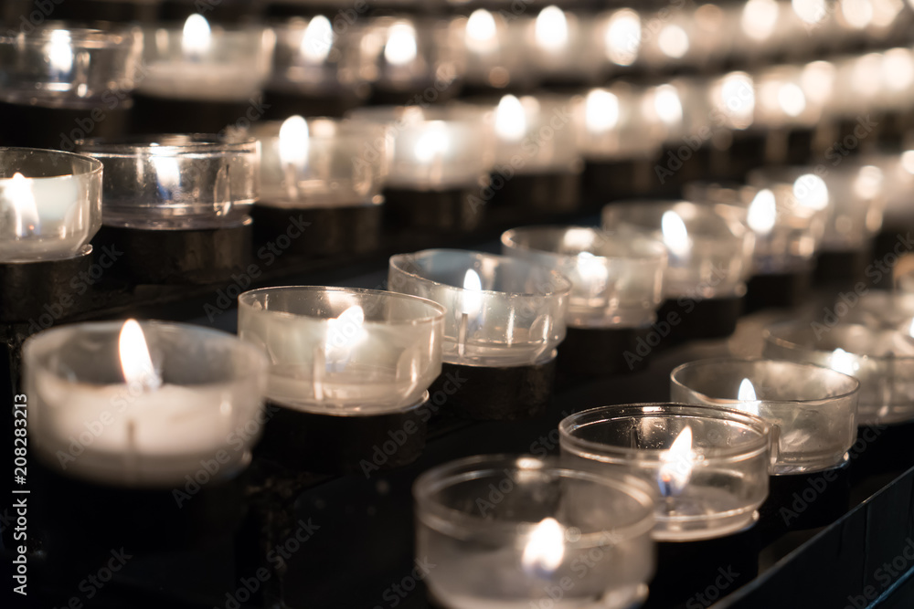 Religion Candle in cathedral - selective focus Religion Candle in cathedral - selective focus
