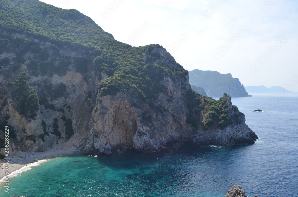 Beautiful Secret Bay Surrounded by Rocky Cliffs. Corfu Island, Greece