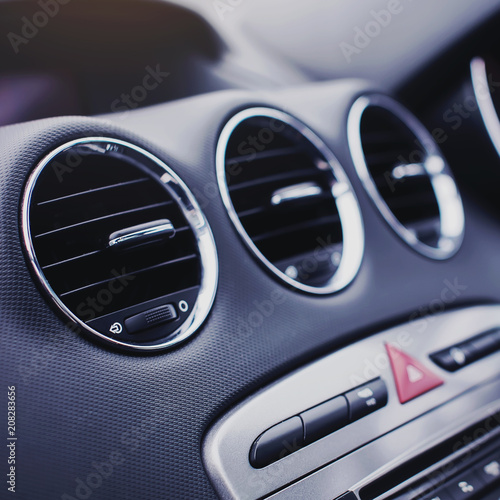 Car air conditioning. The air flow inside the car. Detail audio system buttons in car. © kucheruk