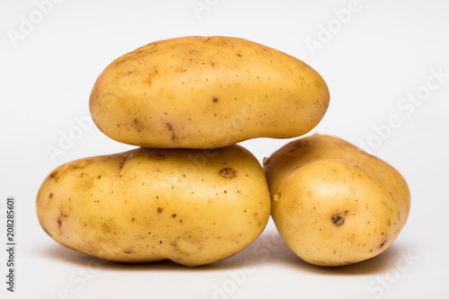 Young potatoes isolated on white background. The crop is new. Flat, top view
