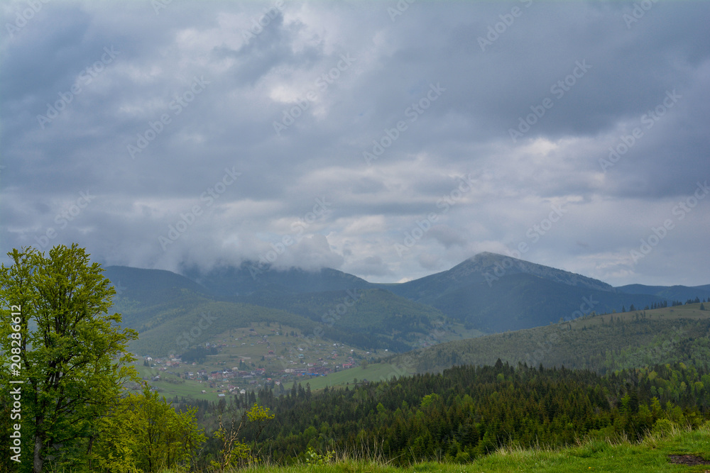 Mountain landscape, in the background - Ukrainian mountain Chornogor in the clouds.