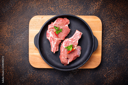 Raw meat  in cast iron pan