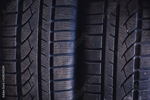 Protector of automobile tires. A number of automobile tires. Close up view on auto mobile new wheel tire surface. Different pattern and type tires for car industry commercial transport transpotration © kucheruk