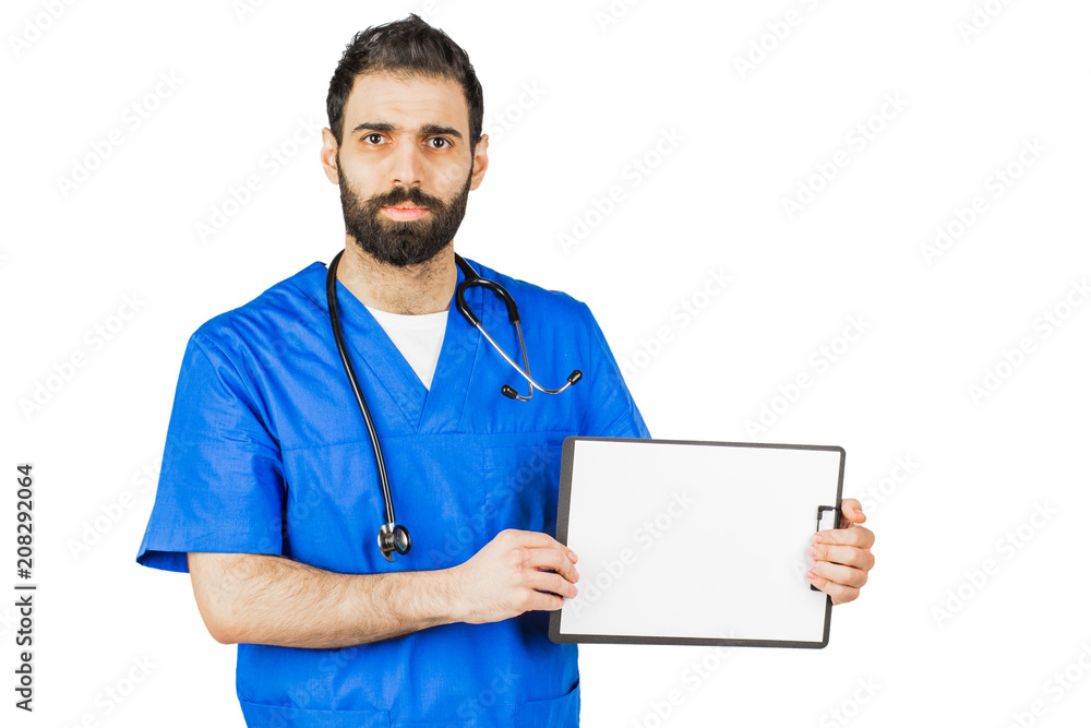 Doctor in blue robe with stethoscope pointing to clipboard isolated on white background Doctor in blue robe with stethoscope pointing to clipboard isolated on white background