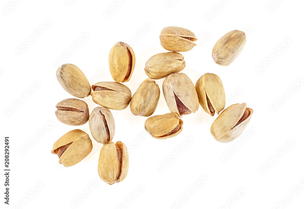 Heap of salted pistachio nuts isolated on white background Heap of salted pistachio nuts isolated on white background