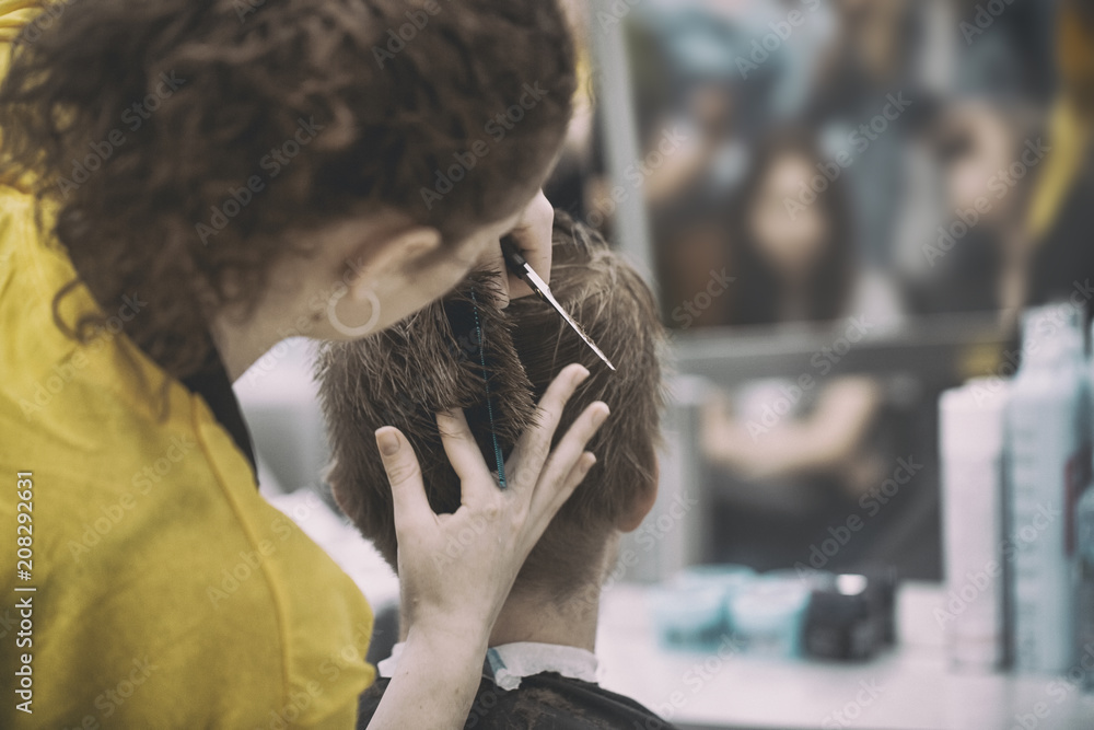 selective focus and blur background barber hair cut with vintage tone. selective focus and blur background barber hair cut with vintage tone.