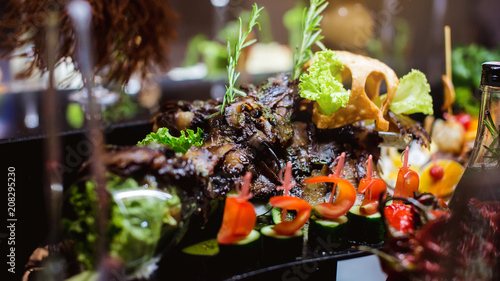 Aubergine cooked on a grill  cut in long pieces and beautifully laid out on a wooden board. Meat for Vegetarian.