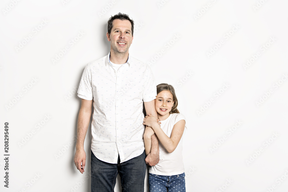 girl with his father, isolated on white wall girl with his father, isolated on white wall