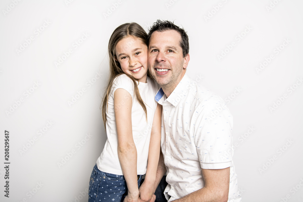 girl with his father, isolated on white wall girl with his father, isolated on white wall
