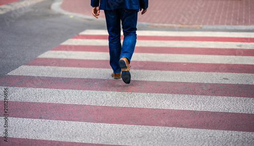 the man on the pedestrian crossing