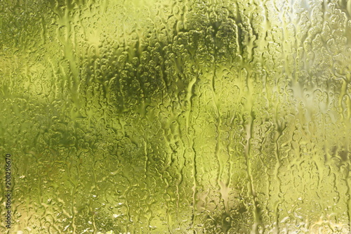 summer rain drops on window glass background texture