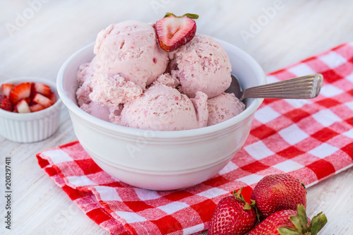 Bowl Filled With Home Made Strawberry Ice Cream With Spoon