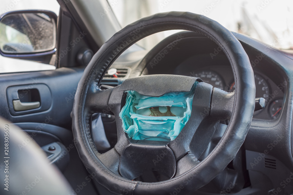 Torn airbag on the steering column of the car, Safety concept for auto-catastrophe