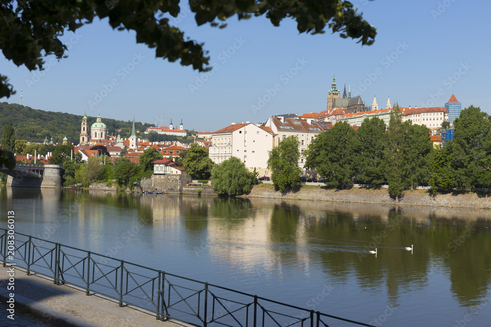 Spring Prague gothic Castle with the Lesser Town above River Vltava in the sunny Day, Czech Republic Spring Prague gothic Castle with the Lesser Town above River Vltava in the sunny Day, Czech Republic